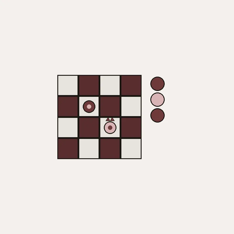 Close detail of the checkers board-piece mark with crown ticks on the sand king.